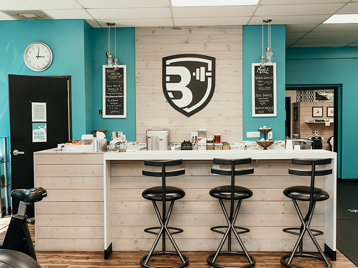 Bar with stools inside Body Basics Boise location.