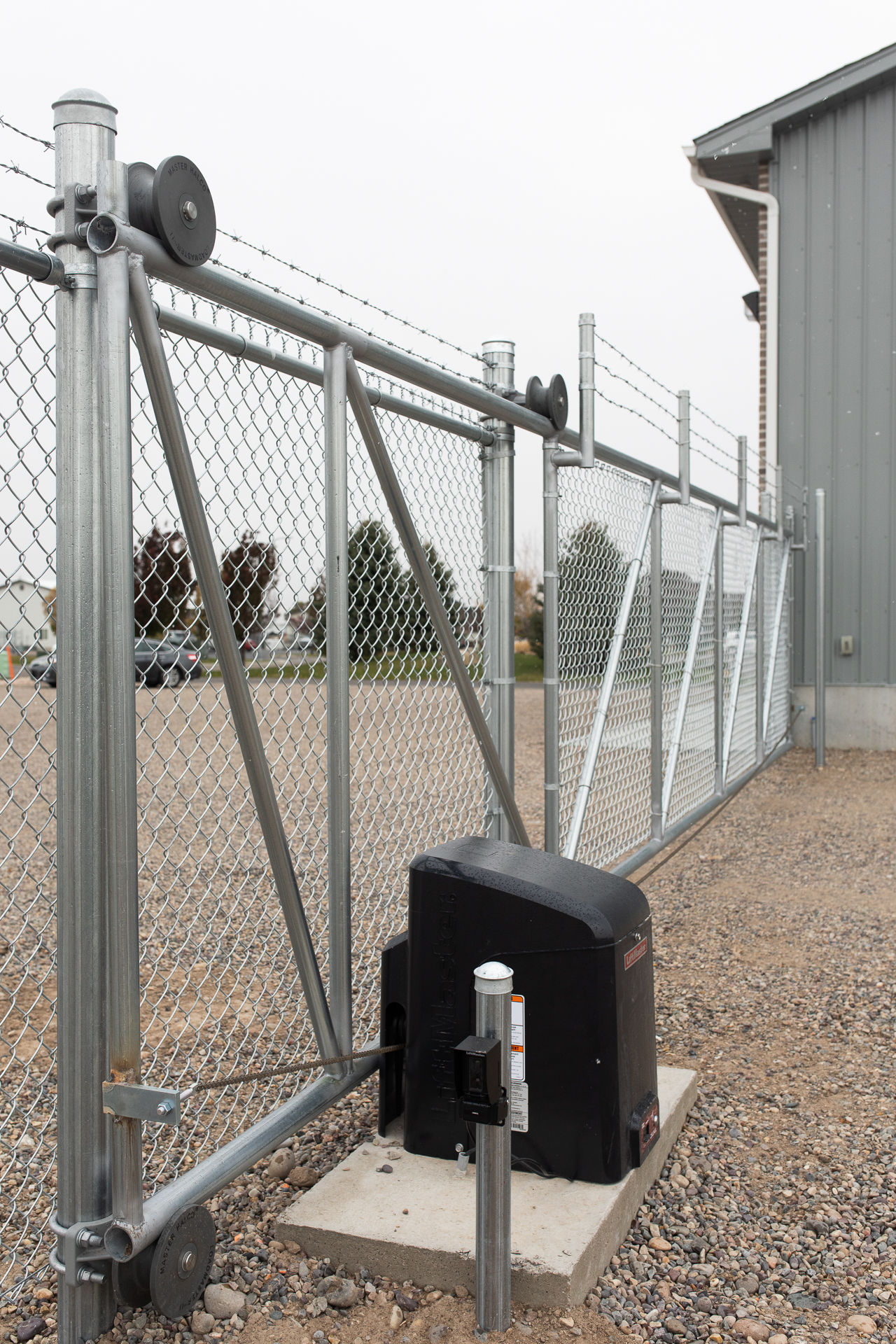 Automatic gate on a metal fence