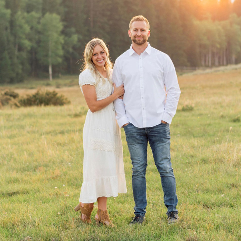 man and woman in a meadow